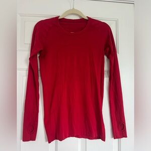 Lululemon swift stride. Barely worn, small pill on back inside of shirt. Size:8
